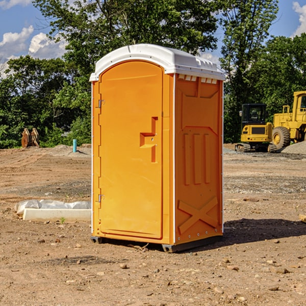 what is the cost difference between standard and deluxe portable restroom rentals in Hennessey